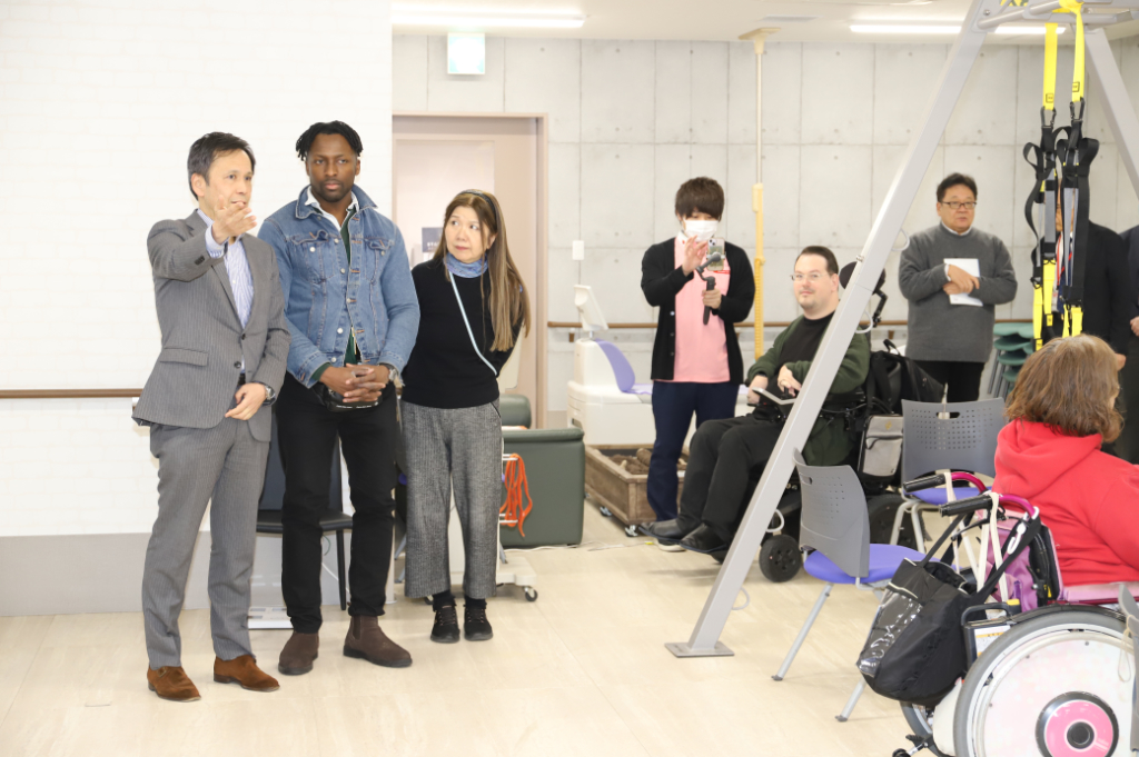 Dr Raphael Olaiya observing clients exercising at A-Cube